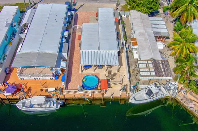 an aerial view of a house with outdoor space