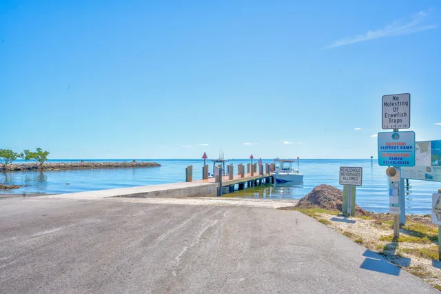 a view of a swimming pool and an outdoor seating