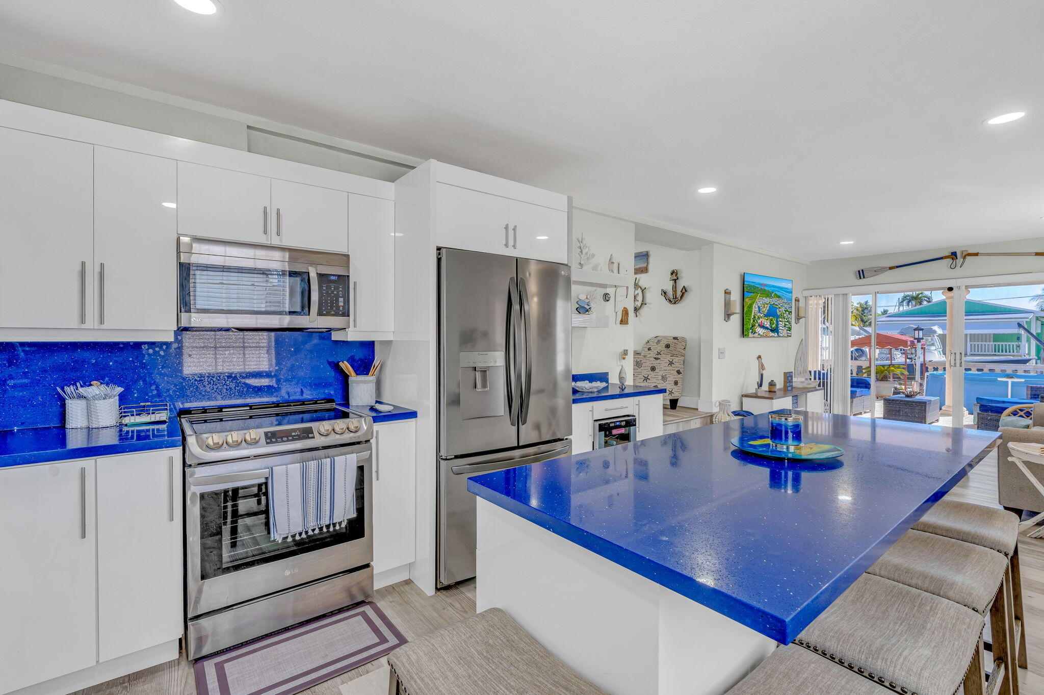 136 Sable Palm Lane Tavernier, FL 33070 - Photo 4 of 39 a kitchen with stainless steel appliances granite countertop a sink refrigerator and cabinets