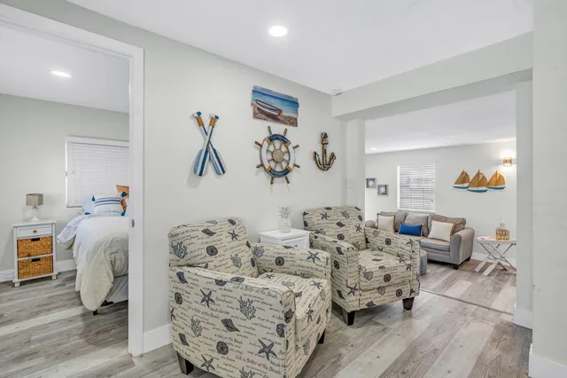 a bedroom with furniture and wooden floor