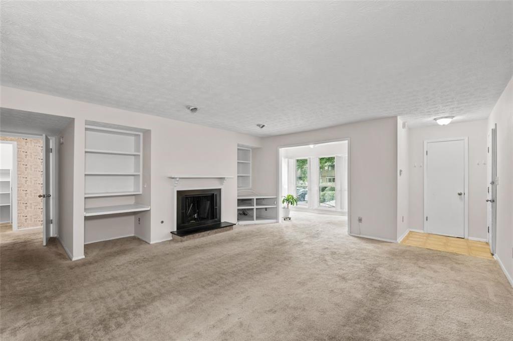 1004 Dunbar Drive Atlanta, GA 30338 - Photo 8 of 23 a view of a livingroom with a fireplace and window