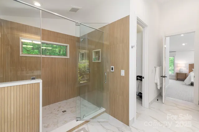 a bathroom with a shower and a sink