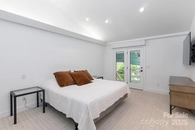 a bedroom with a bed and a couch