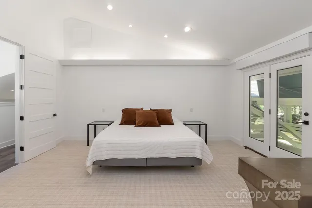 a bedroom with a bed and with furniture