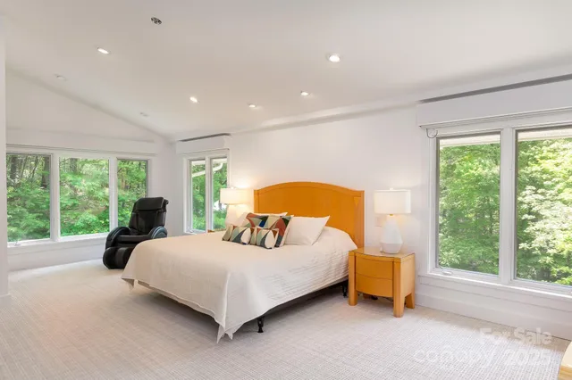 a bedroom with a bed and a table