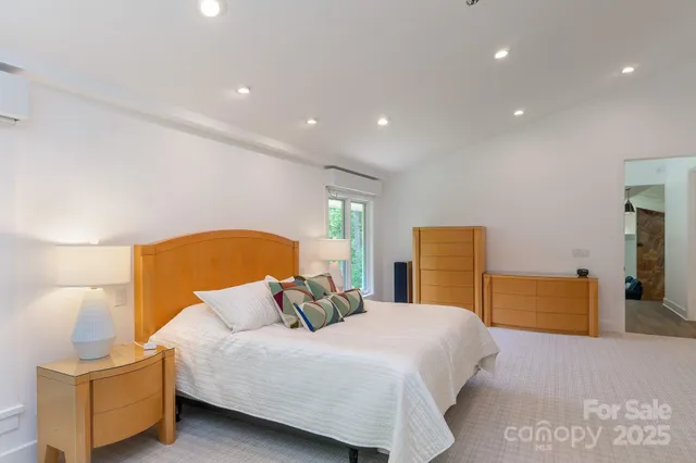 a bedroom with a bed and a couch