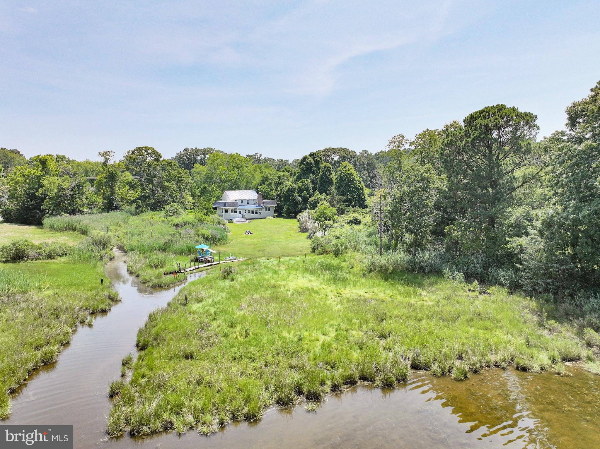 8000 Bozman Neavitt Road St. Michaels, MD 21663 - Photo 3 of 57 a view of a lake with top of house