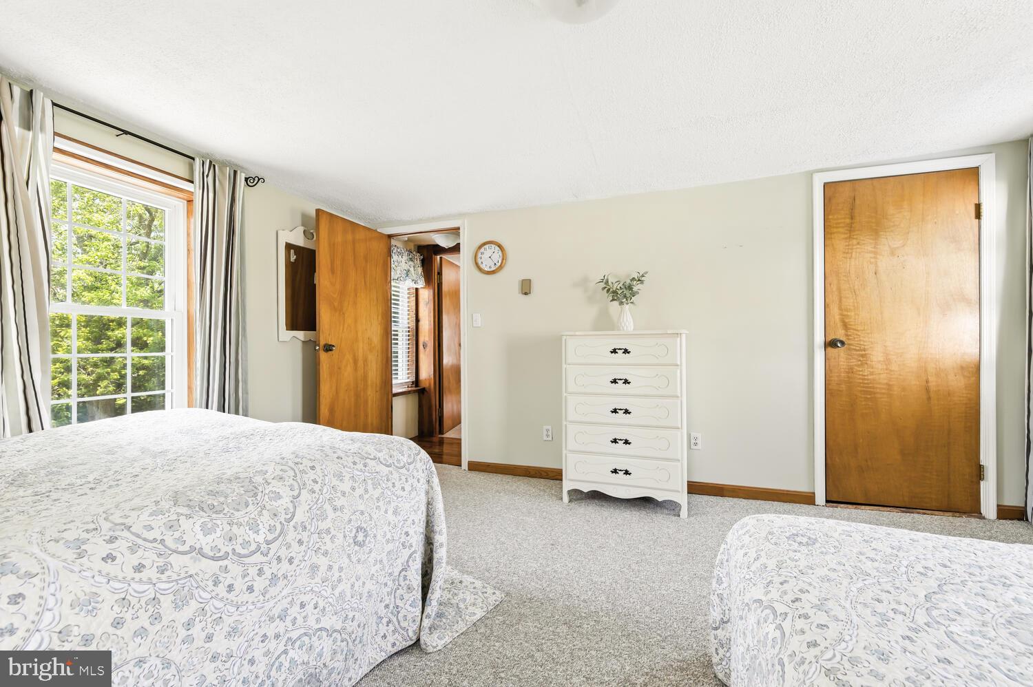 8000 Bozman Neavitt Road St. Michaels, MD 21663 - Photo 44 of 57 a bedroom with a bed and a window