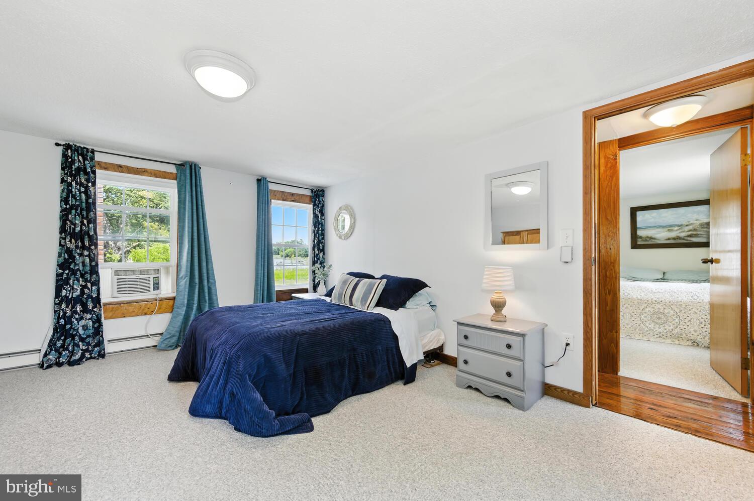 8000 Bozman Neavitt Road St. Michaels, MD 21663 - Photo 46 of 57 a bedroom with a bed and a window