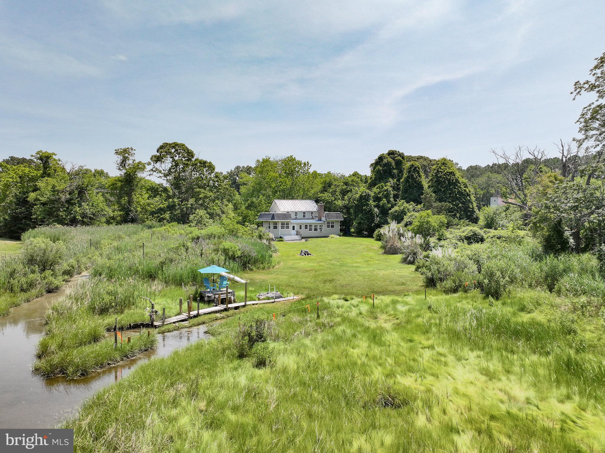 8000 Bozman Neavitt Road St. Michaels, MD 21663 - Photo 49 of 57 a view of a city with lush green forest