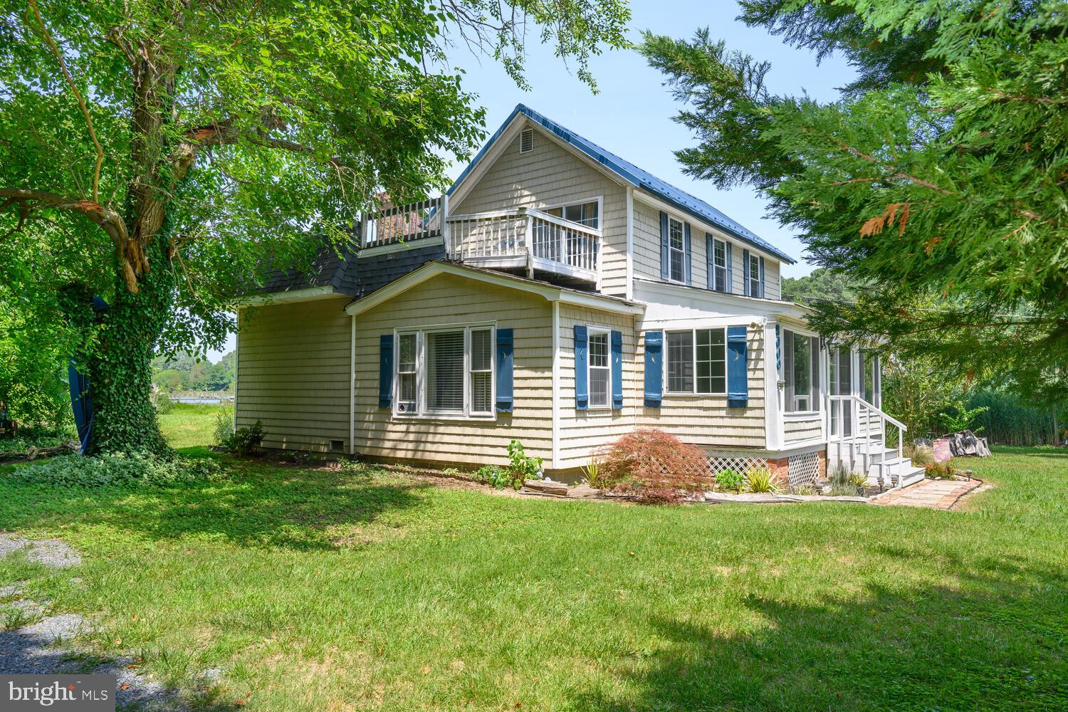 8000 Bozman Neavitt Road St. Michaels, MD 21663 - Photo 5 of 57 a front view of house with yard and green space