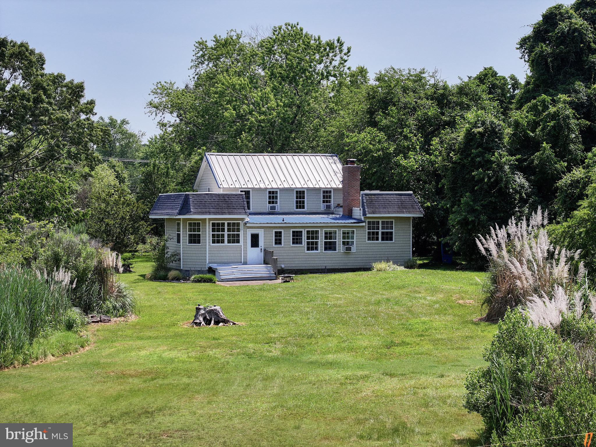 8000 Bozman Neavitt Road St. Michaels, MD 21663 - Photo 55 of 57 a view of a house with a yard balcony and sitting area