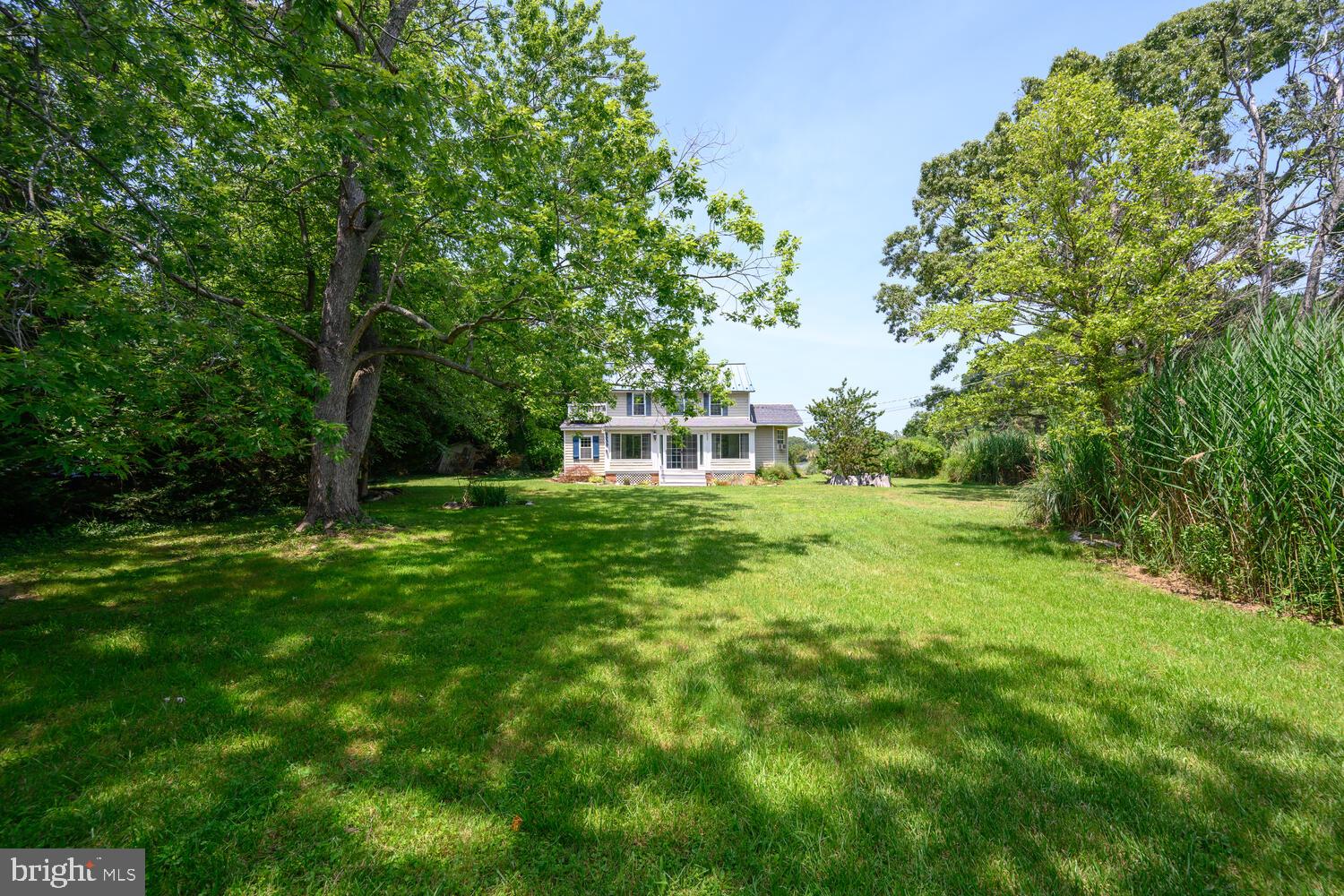 8000 Bozman Neavitt Road St. Michaels, MD 21663 - Photo 6 of 57 a front view of a house with a yard