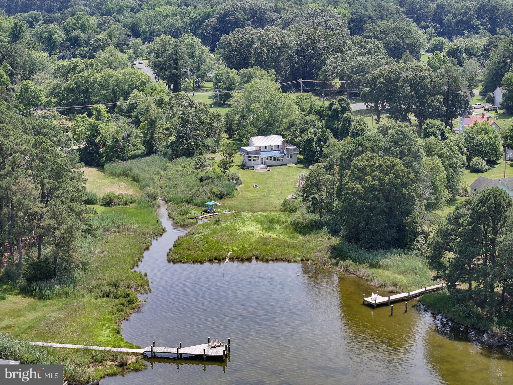 8000 Bozman Neavitt Road St. Michaels, MD 21663 - Photo 7 of 57 an aerial view of residential house with outdoor space and lake view