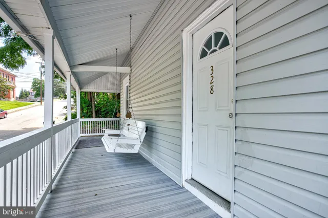 a porch with wooden floors