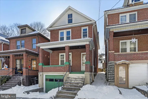 a front view of a house with a garage