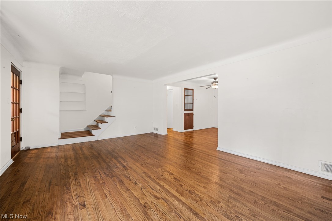 3799 Colony Road South Euclid, OH 44118 - Photo 5 of 34 Unfurnished living room featuring ceiling fan and wood-type flooring