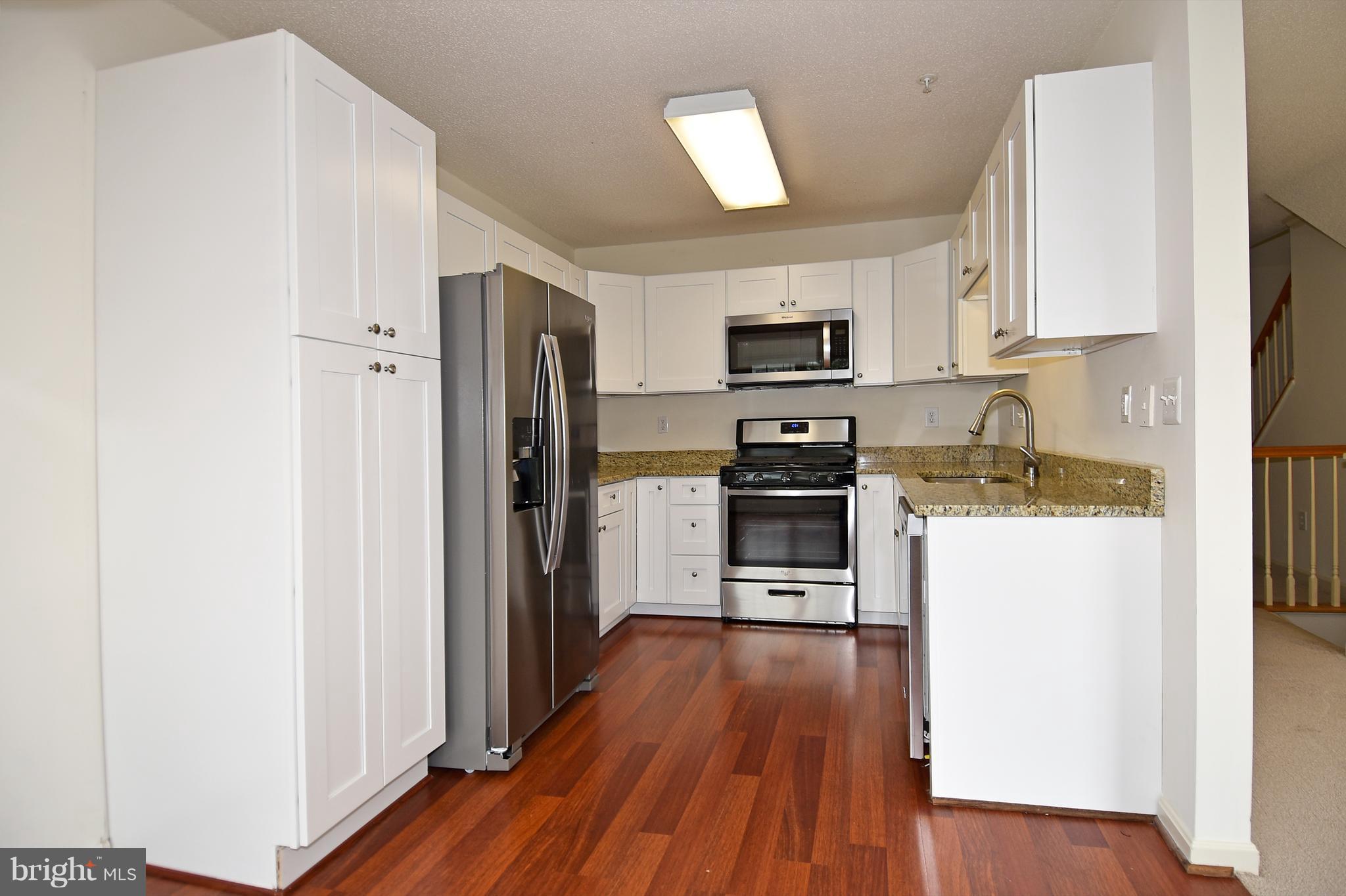 2346 Cold Meadow Way Silver Spring, MD 20906 - Photo 11 of 30 KITCHEN HAS NEW CABINETS AND GRANITE COUNTERSTOPS