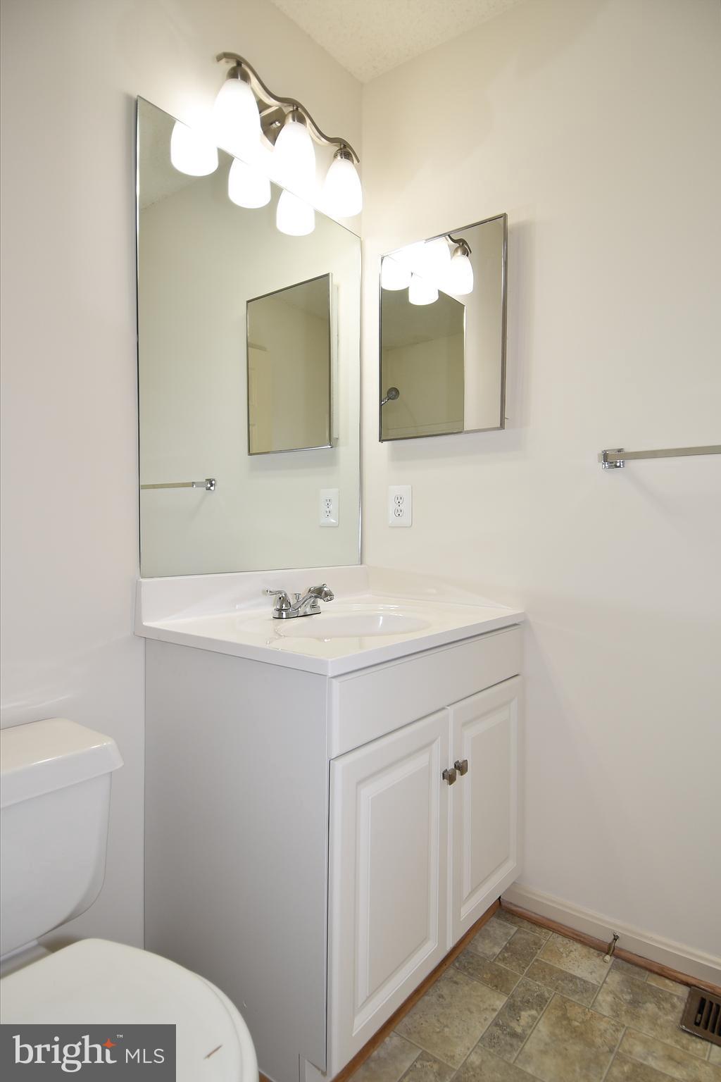 2346 Cold Meadow Way Silver Spring, MD 20906 - Photo 20 of 30 UPPER LEVEL HALL BATH NEW VANITY AND LIGHT FIXTURE