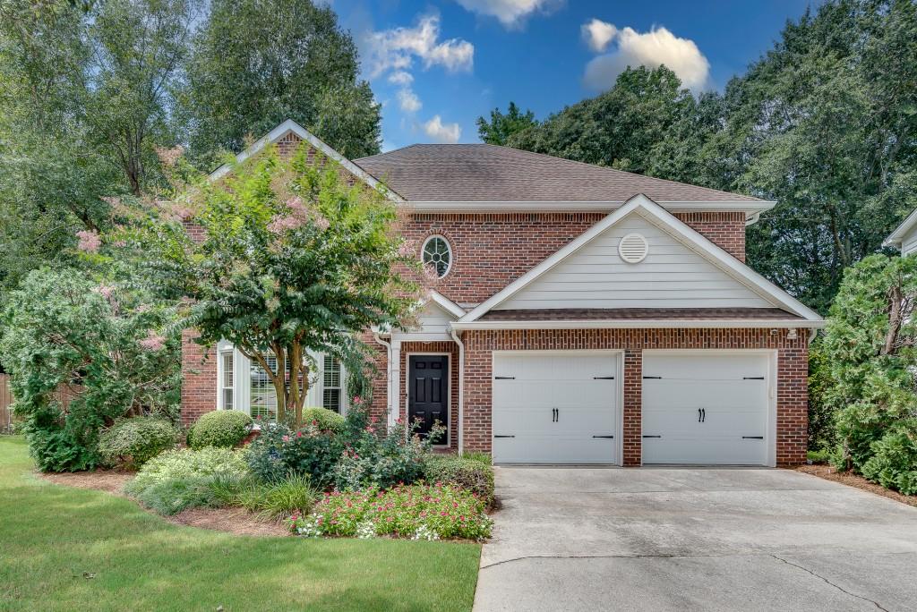 1410 Crescent Walk Decatur, GA 30033 - Photo 1 of 1 a front view of a house with a yard and garage