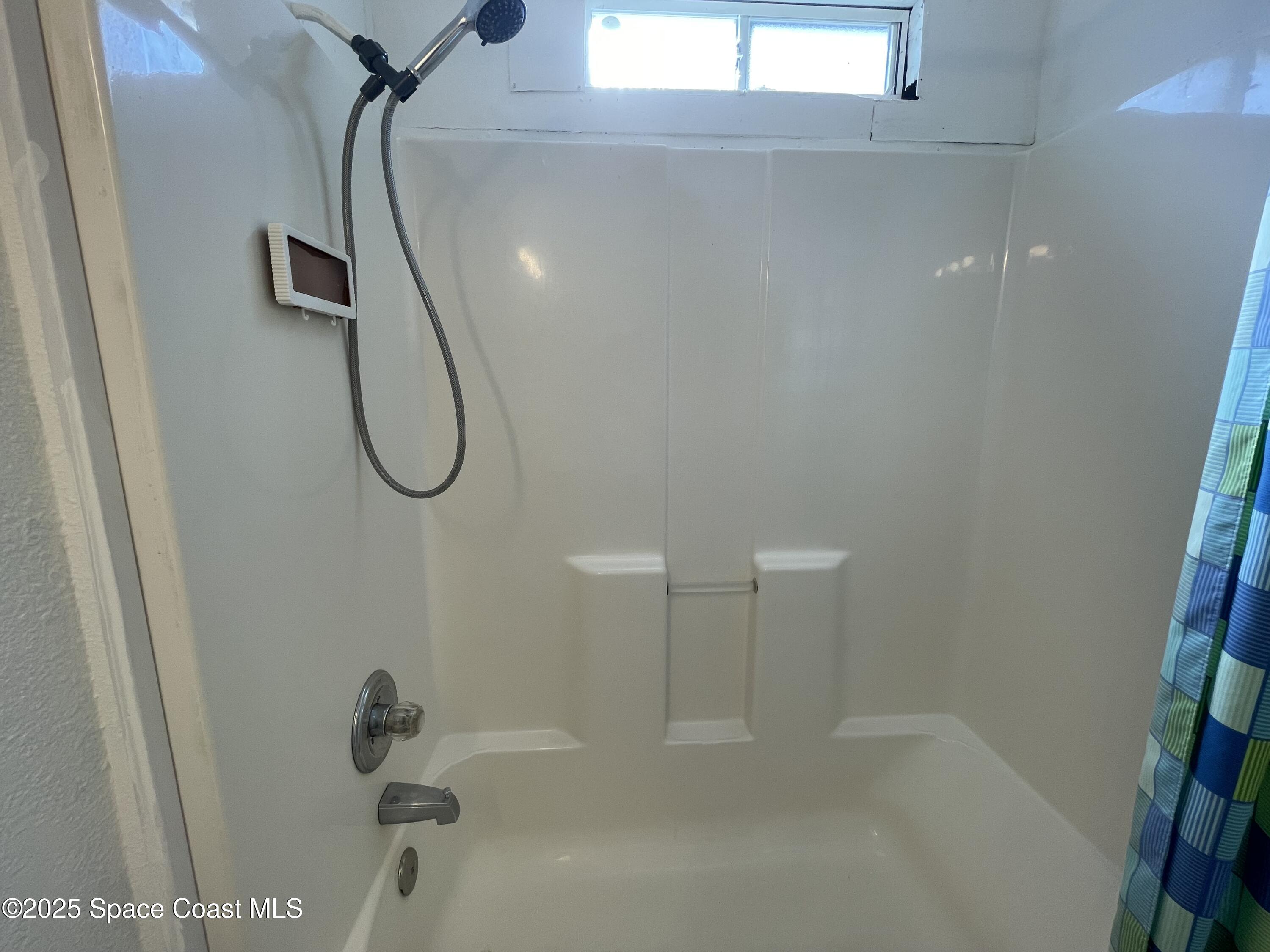 7002 Ash Drive Cocoa, FL 32927 - Photo 12 of 17 a bathroom with a shower