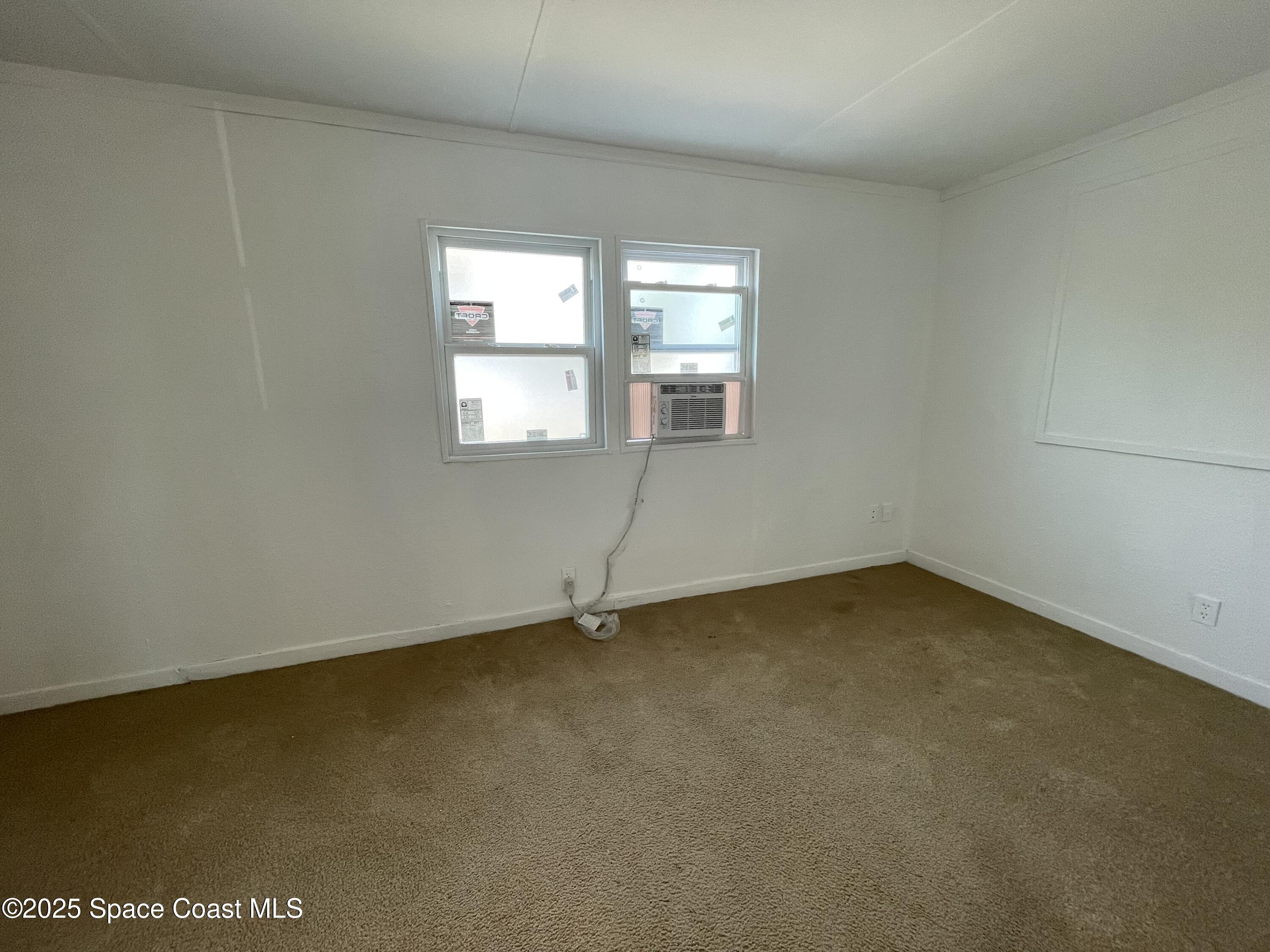7002 Ash Drive Cocoa, FL 32927 - Photo 15 of 17 an empty room with a window