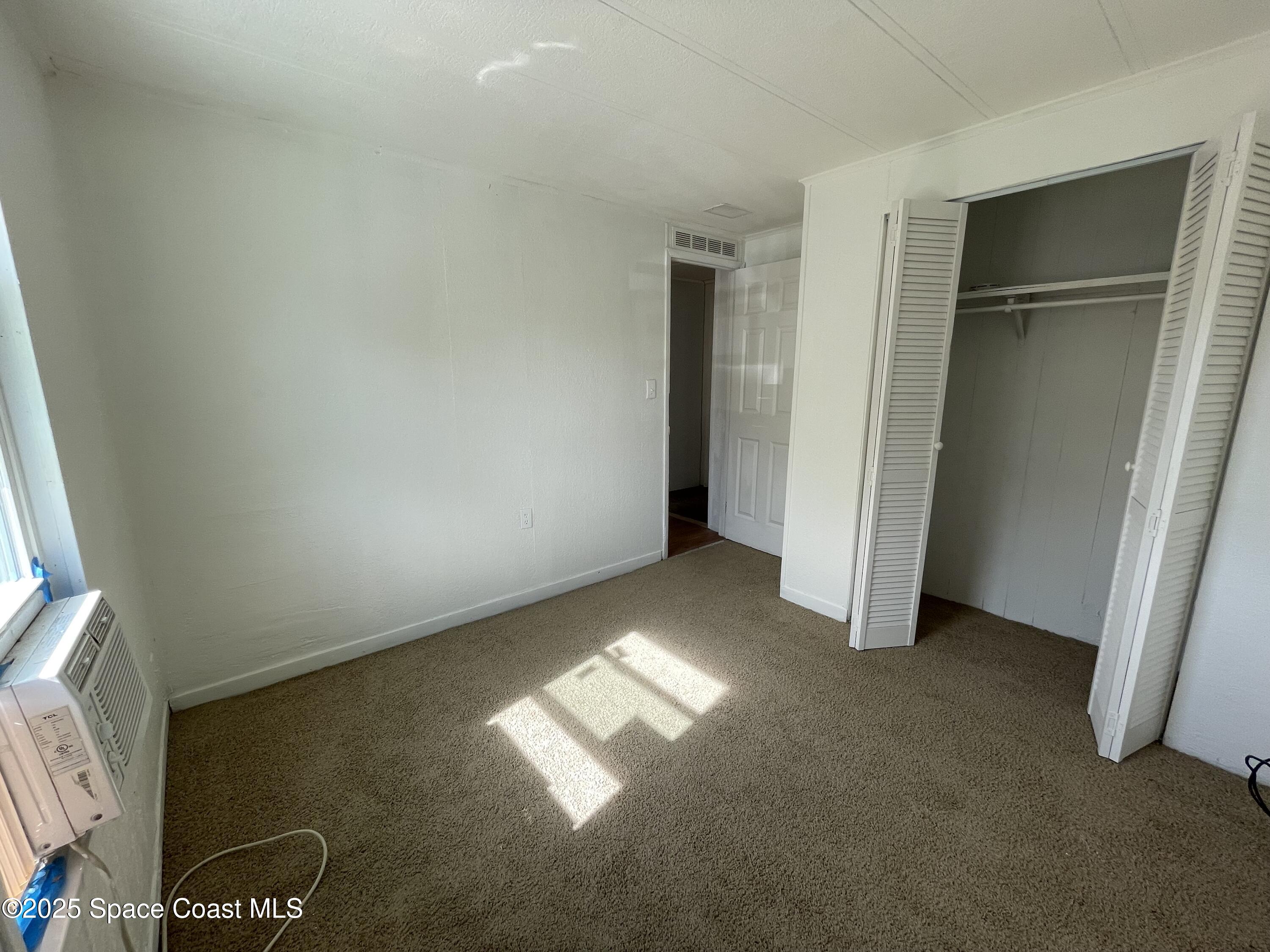 7002 Ash Drive Cocoa, FL 32927 - Photo 16 of 17 a view of empty room with window
