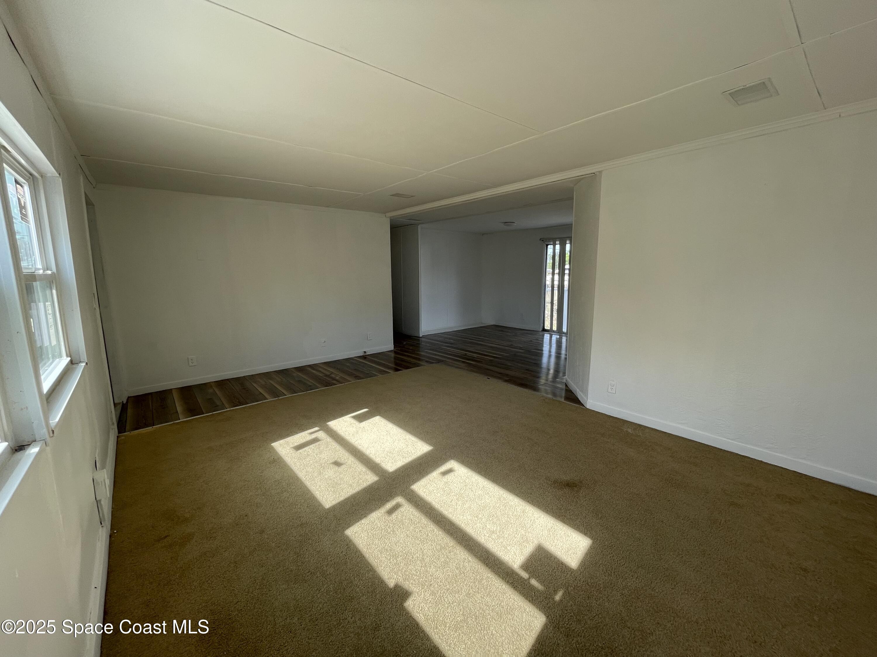 7002 Ash Drive Cocoa, FL 32927 - Photo 7 of 17 a view of an empty room and window