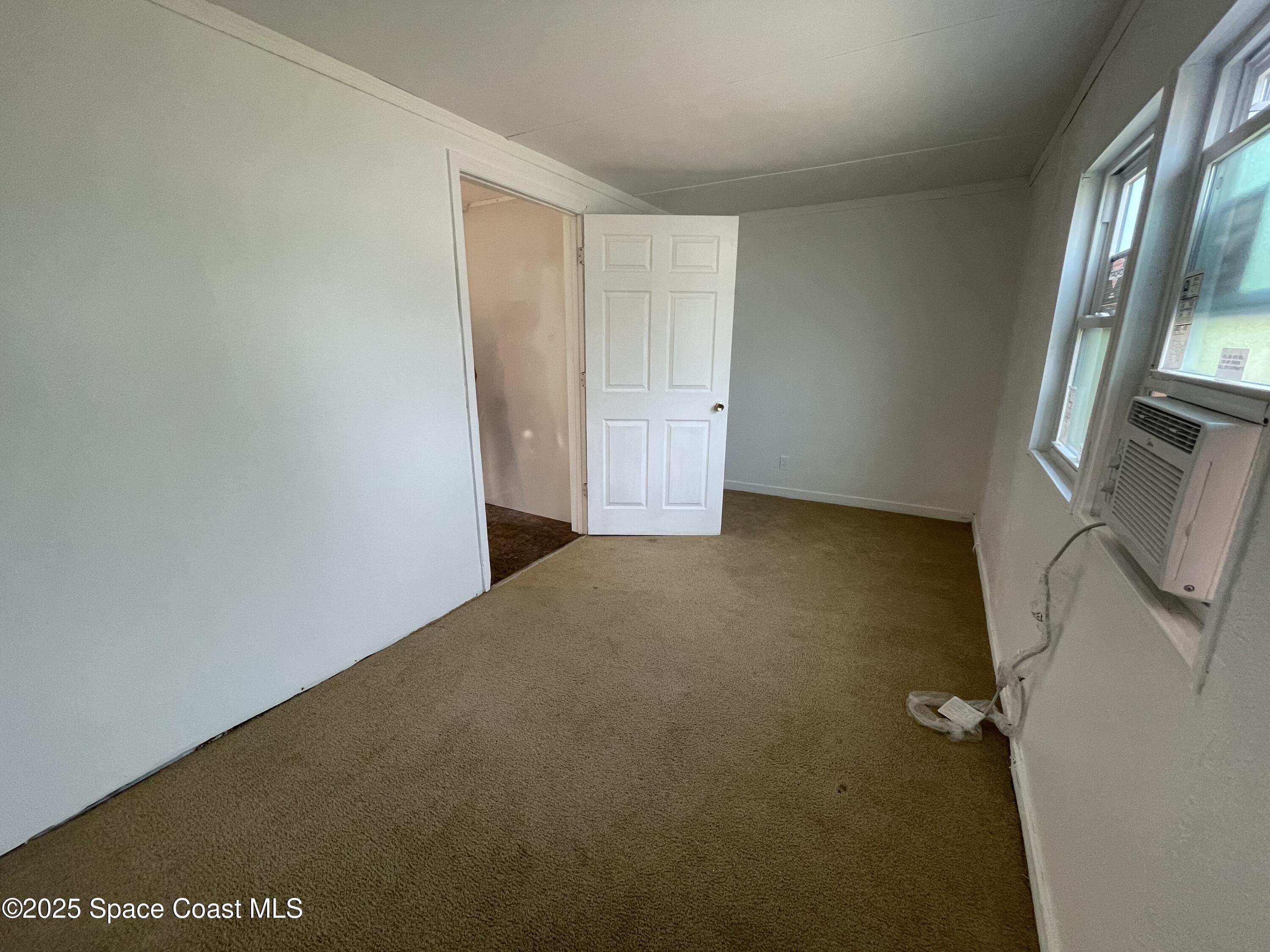 7002 Ash Drive Cocoa, FL 32927 - Photo 9 of 17 an empty room with windows
