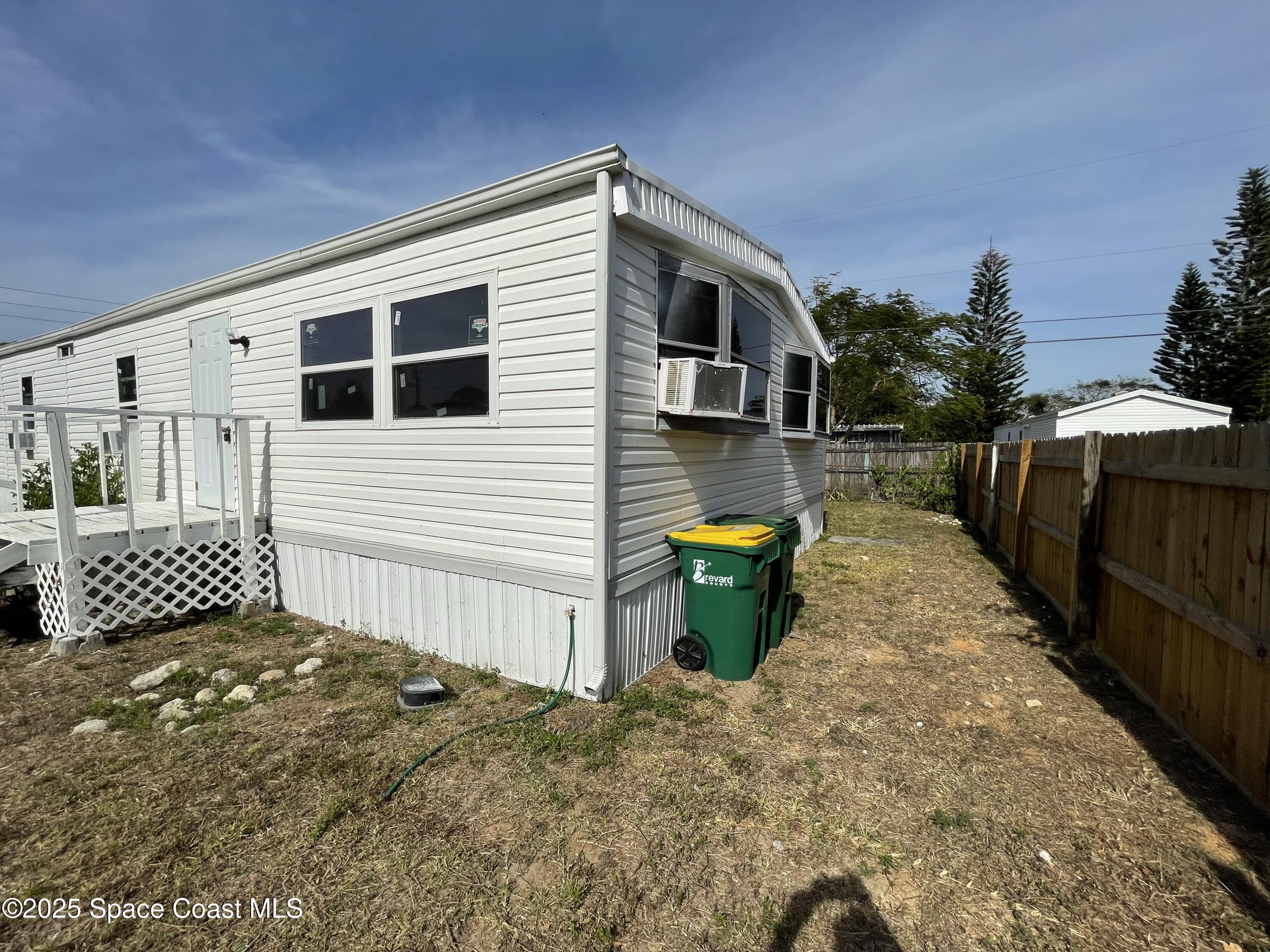 7002 Ash Drive Cocoa, FL 32927 - Photo 10 of 17 a view of a back yard of the house