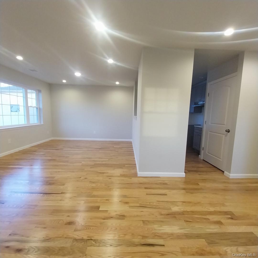 343 Jackson Street, Unit 5 Hempstead, NY 11550 - Photo 6 of 16 Empty room with recessed lighting and light wood-style flooring