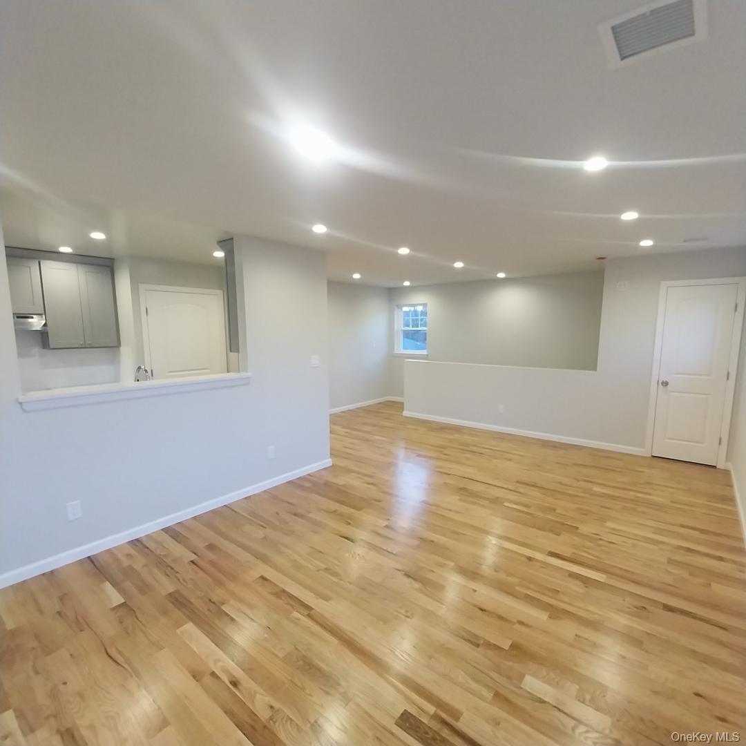 343 Jackson Street, Unit 5 Hempstead, NY 11550 - Photo 7 of 16 Empty room featuring recessed lighting and light wood-style floors