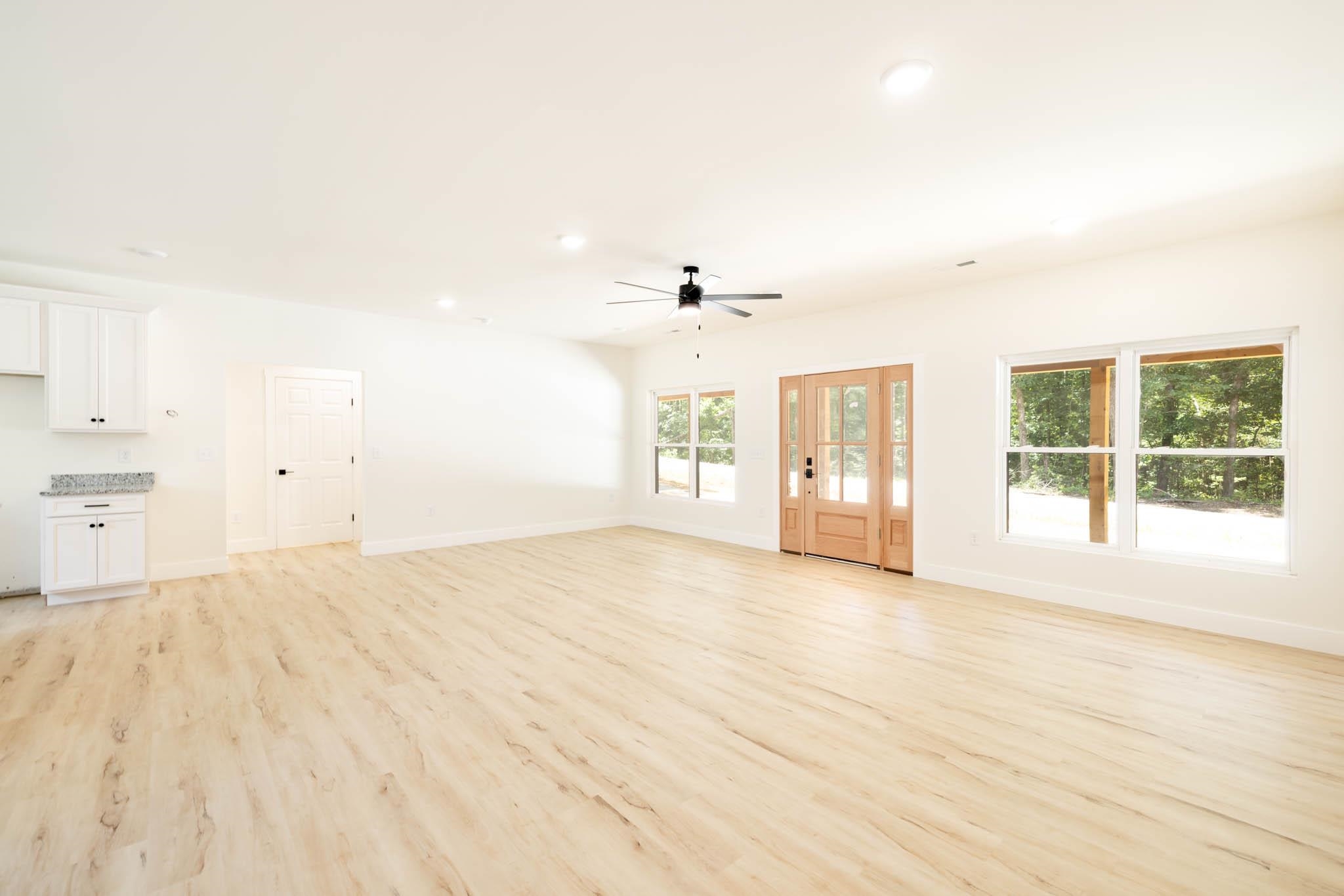 37 William Teague Lane Ramer, TN 38367 - Photo 12 of 39 Expansive interior with light wood-finish flooring, white walls, and recessed lighting