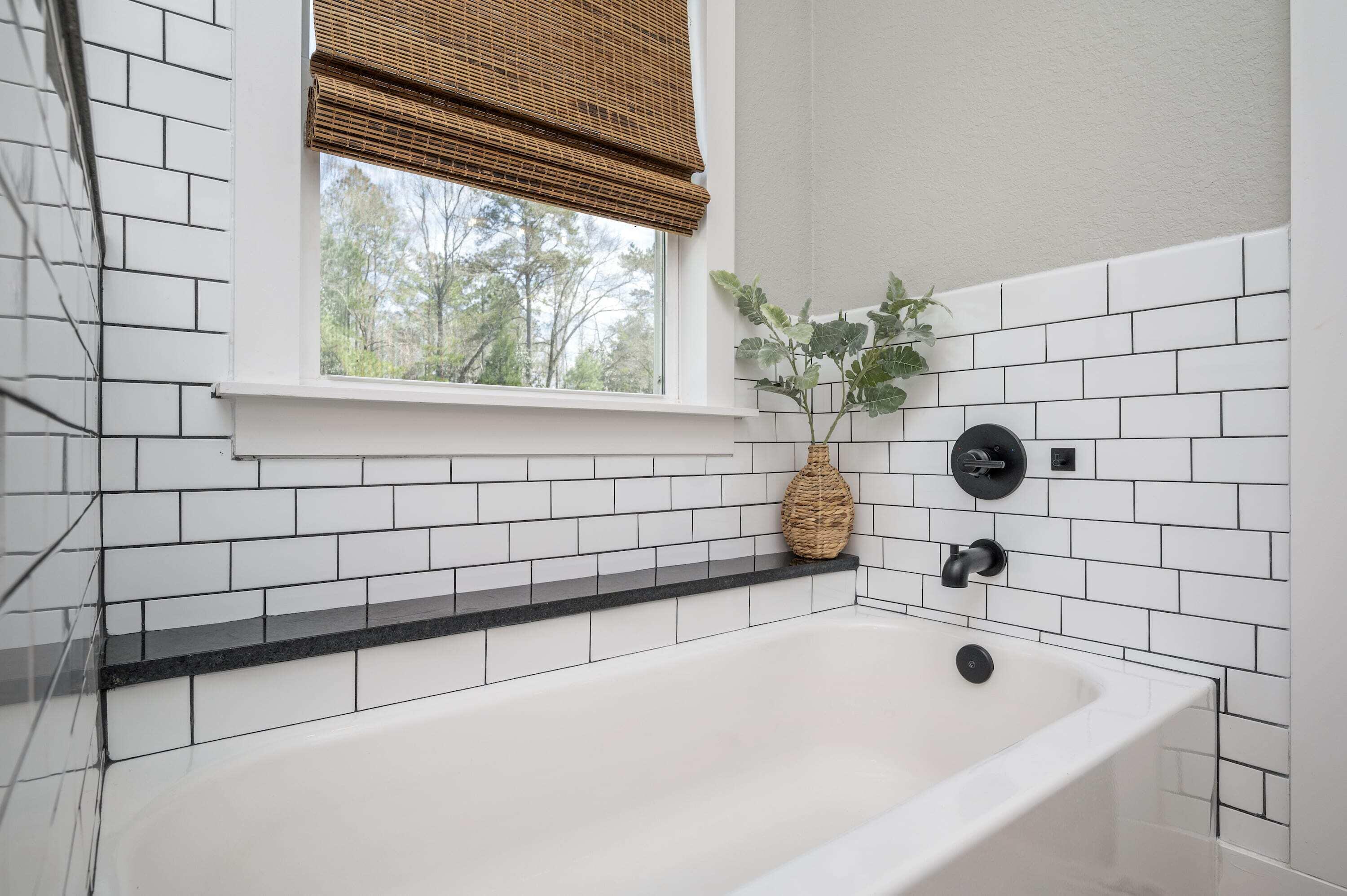 8151 Tommy Steele Road Baker, FL 32531 - Photo 14 of 36 a bathroom with a bathtub and shower