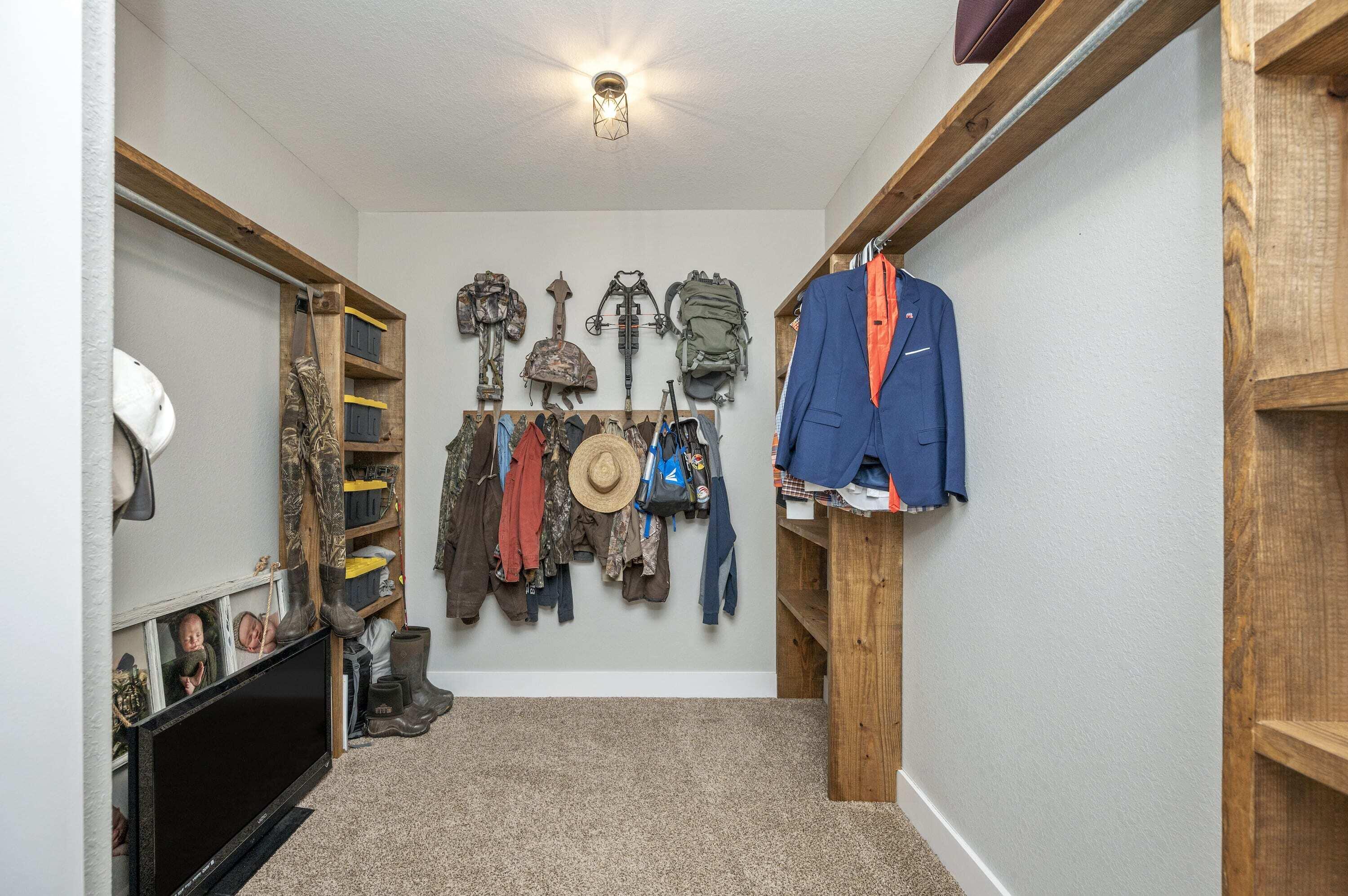 8151 Tommy Steele Road Baker, FL 32531 - Photo 16 of 36 a view of walk in closet with clothes