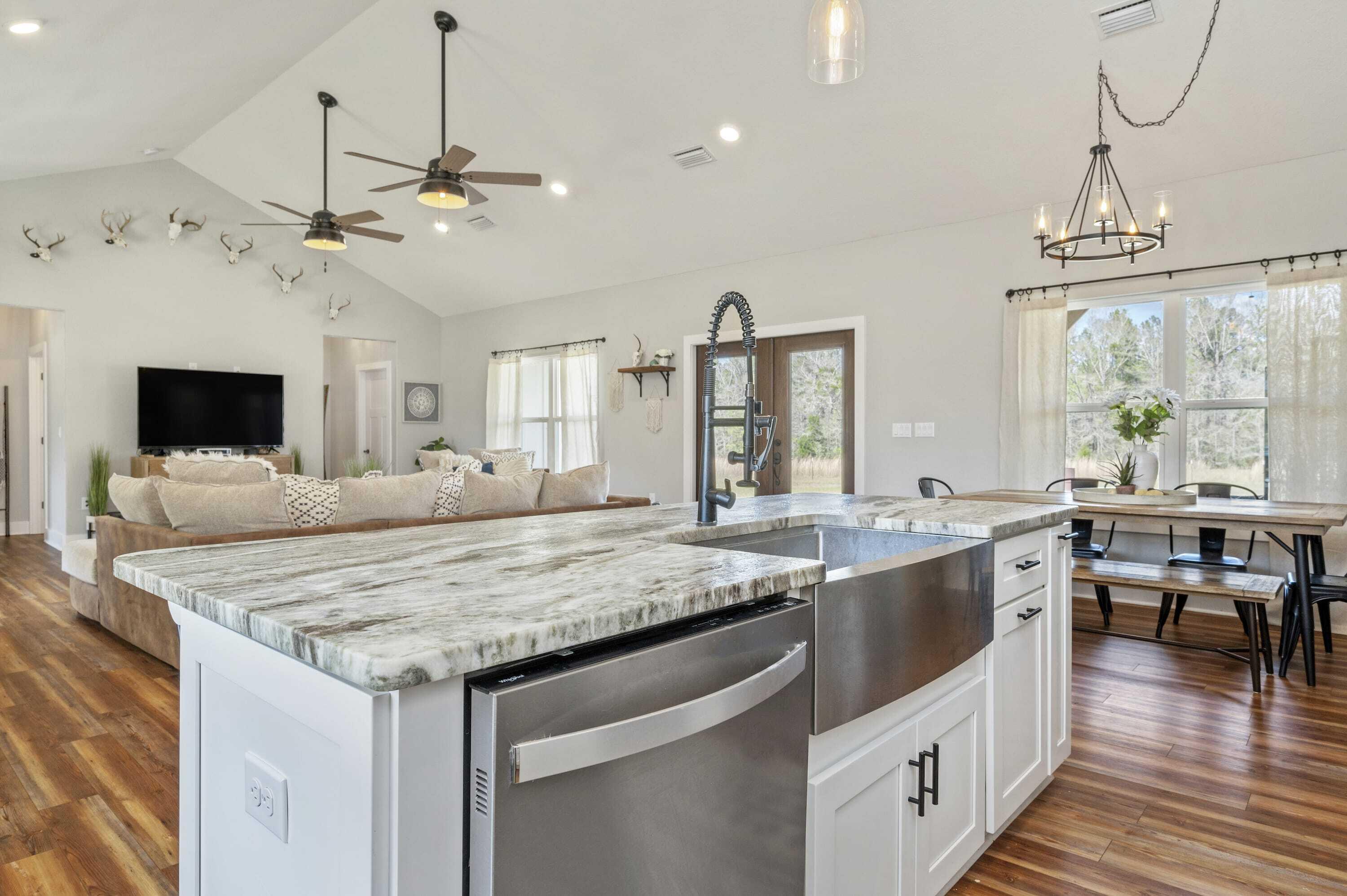 8151 Tommy Steele Road Baker, FL 32531 - Photo 22 of 36 a kitchen with granite countertop a sink and center island
