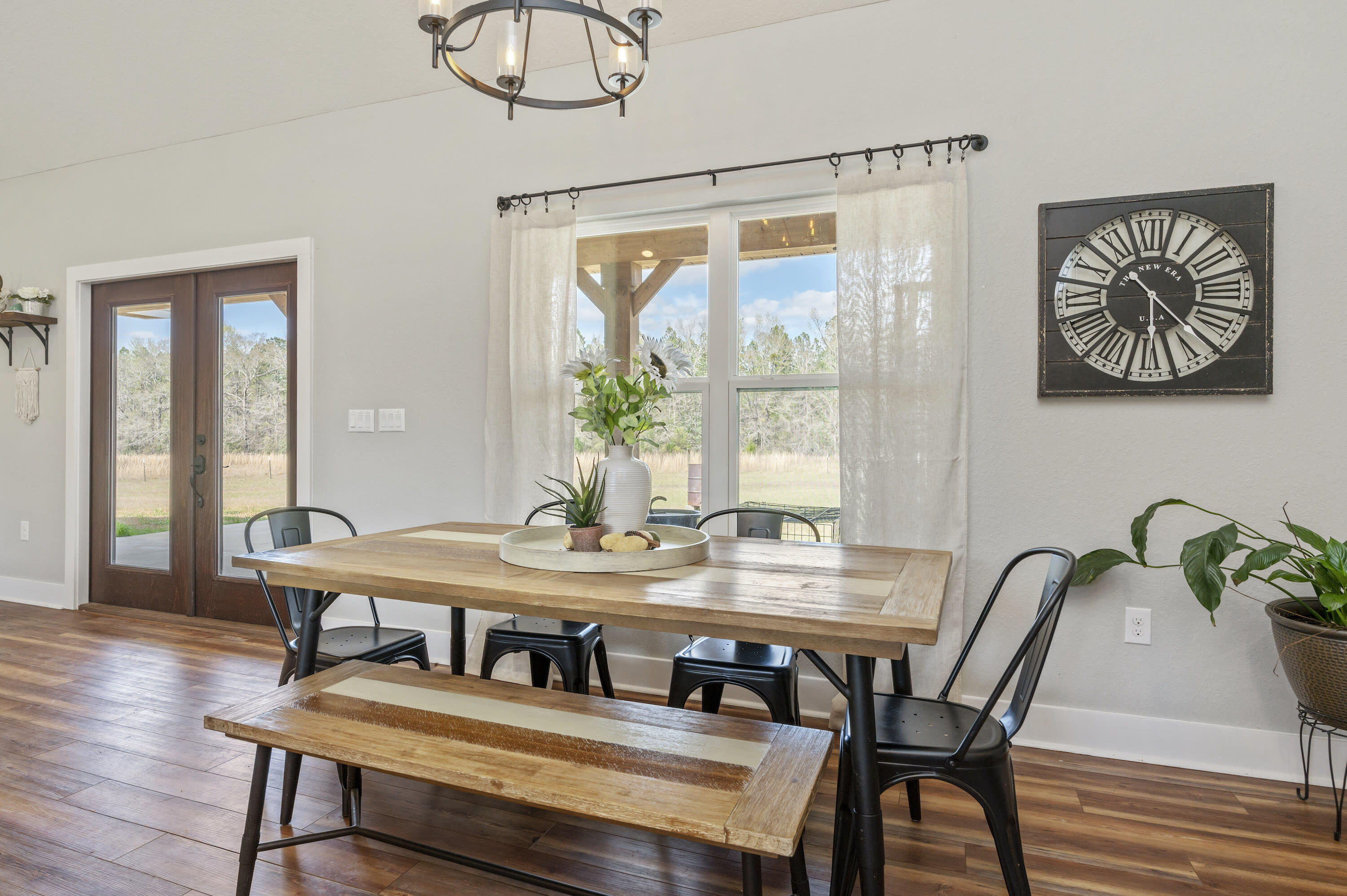 8151 Tommy Steele Road Baker, FL 32531 - Photo 24 of 36 a view of a dining room with furniture window and wooden floor