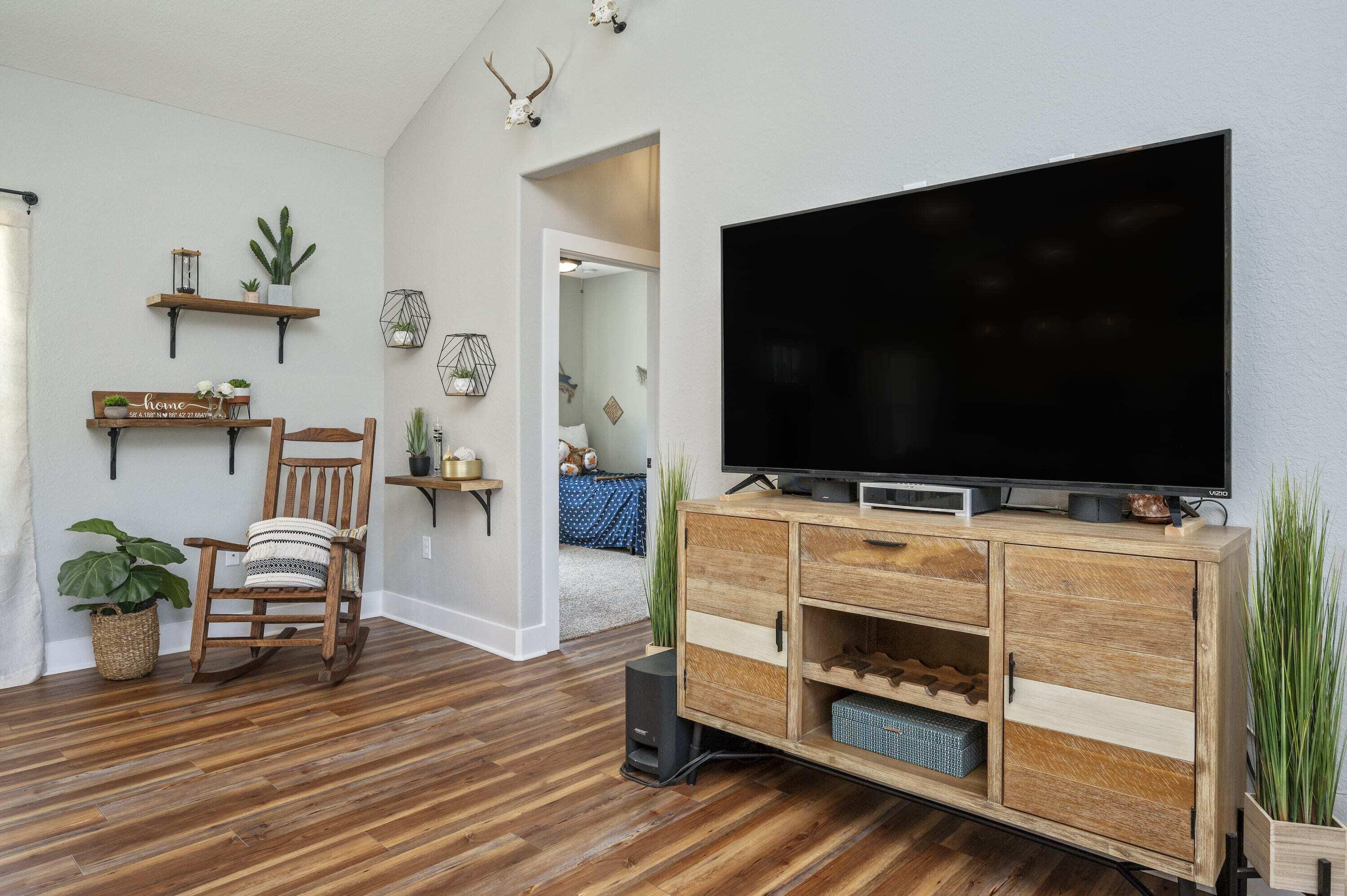 8151 Tommy Steele Road Baker, FL 32531 - Photo 27 of 36 a living room with furniture and a flat screen tv