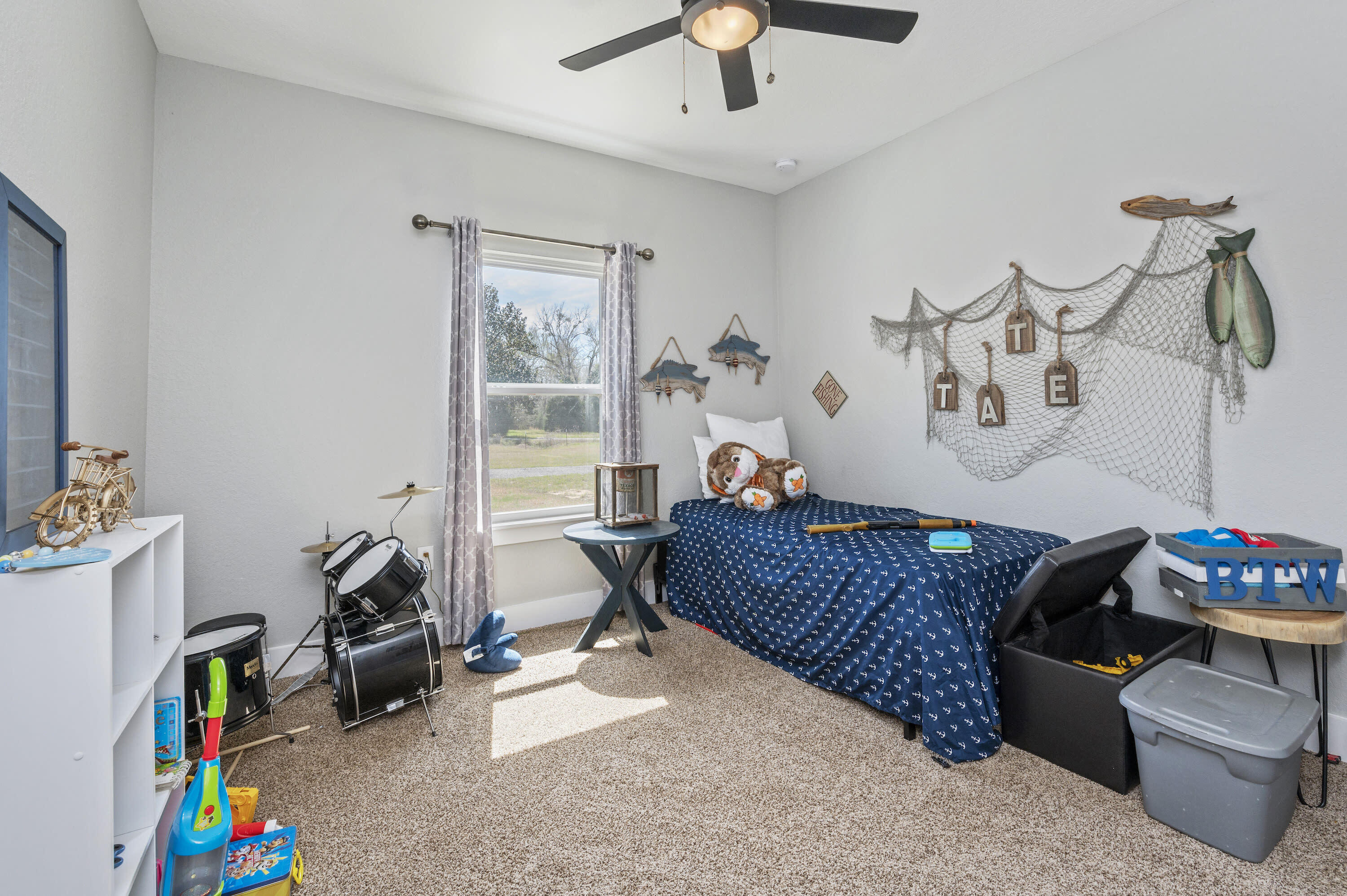 8151 Tommy Steele Road Baker, FL 32531 - Photo 28 of 36 a living room with furniture and a window