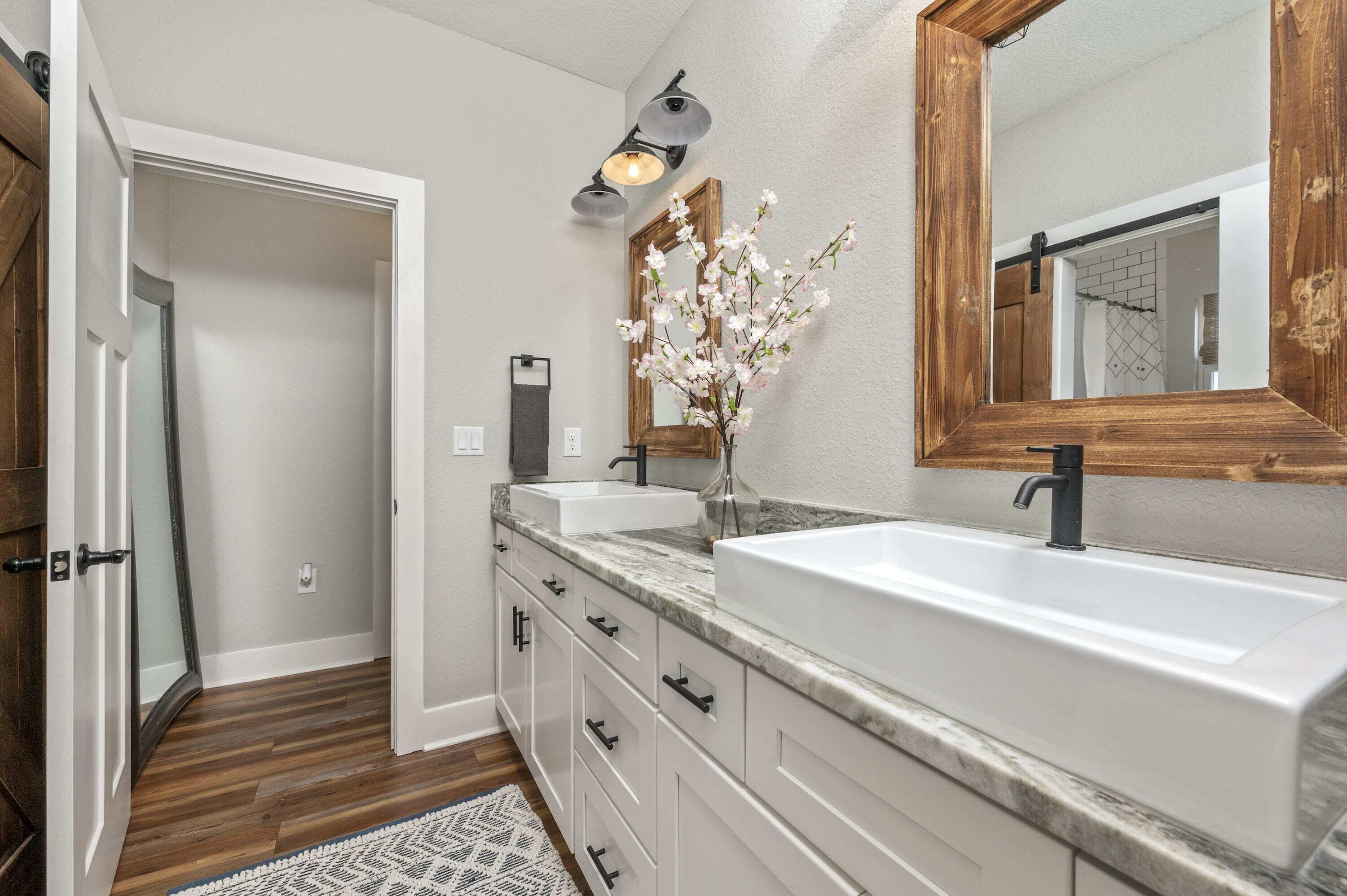 8151 Tommy Steele Road Baker, FL 32531 - Photo 29 of 36 a bathroom with a sink and a mirror