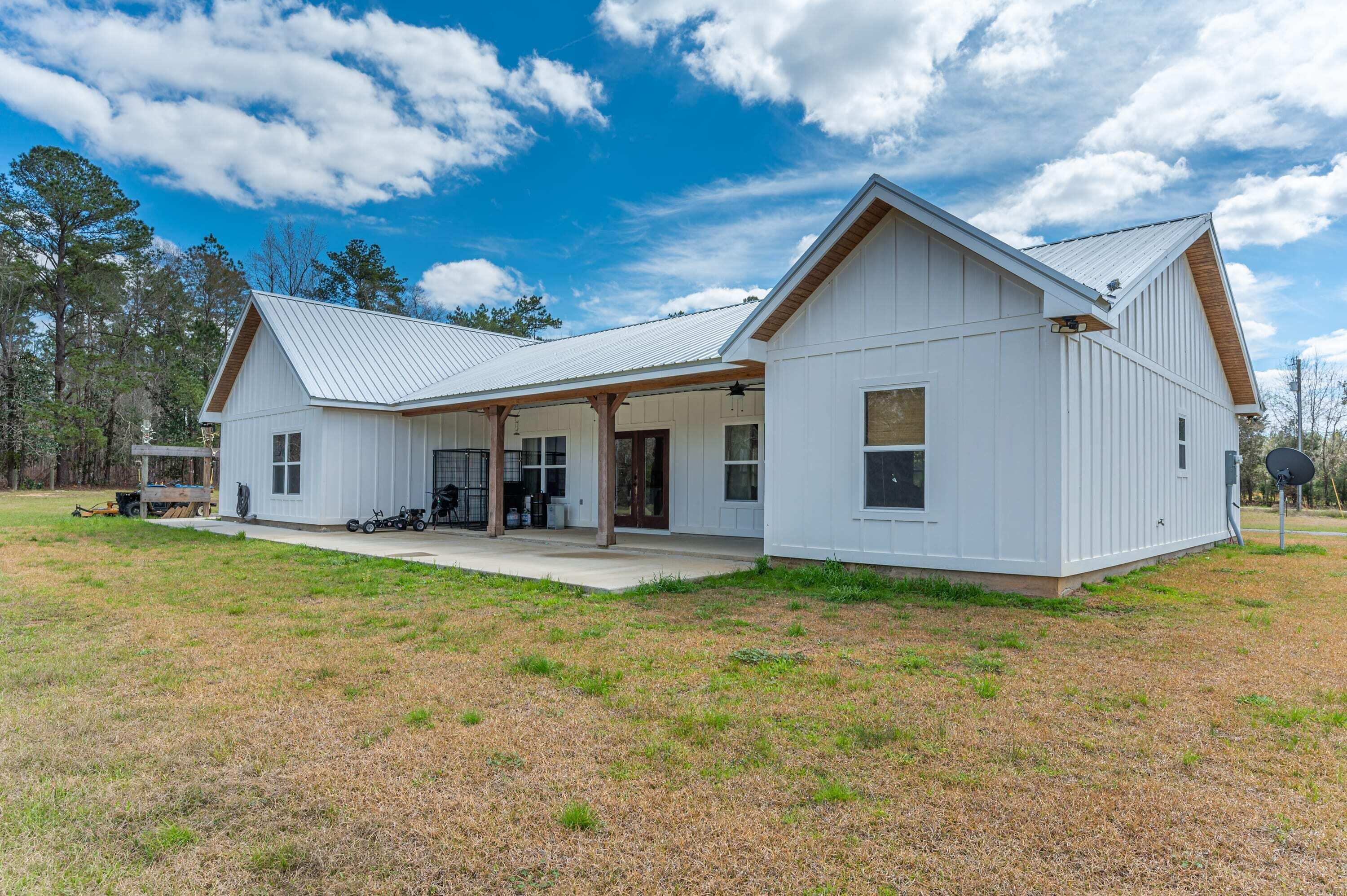 8151 Tommy Steele Road Baker, FL 32531 - Photo 4 of 36 a view of a house with pool and a yard