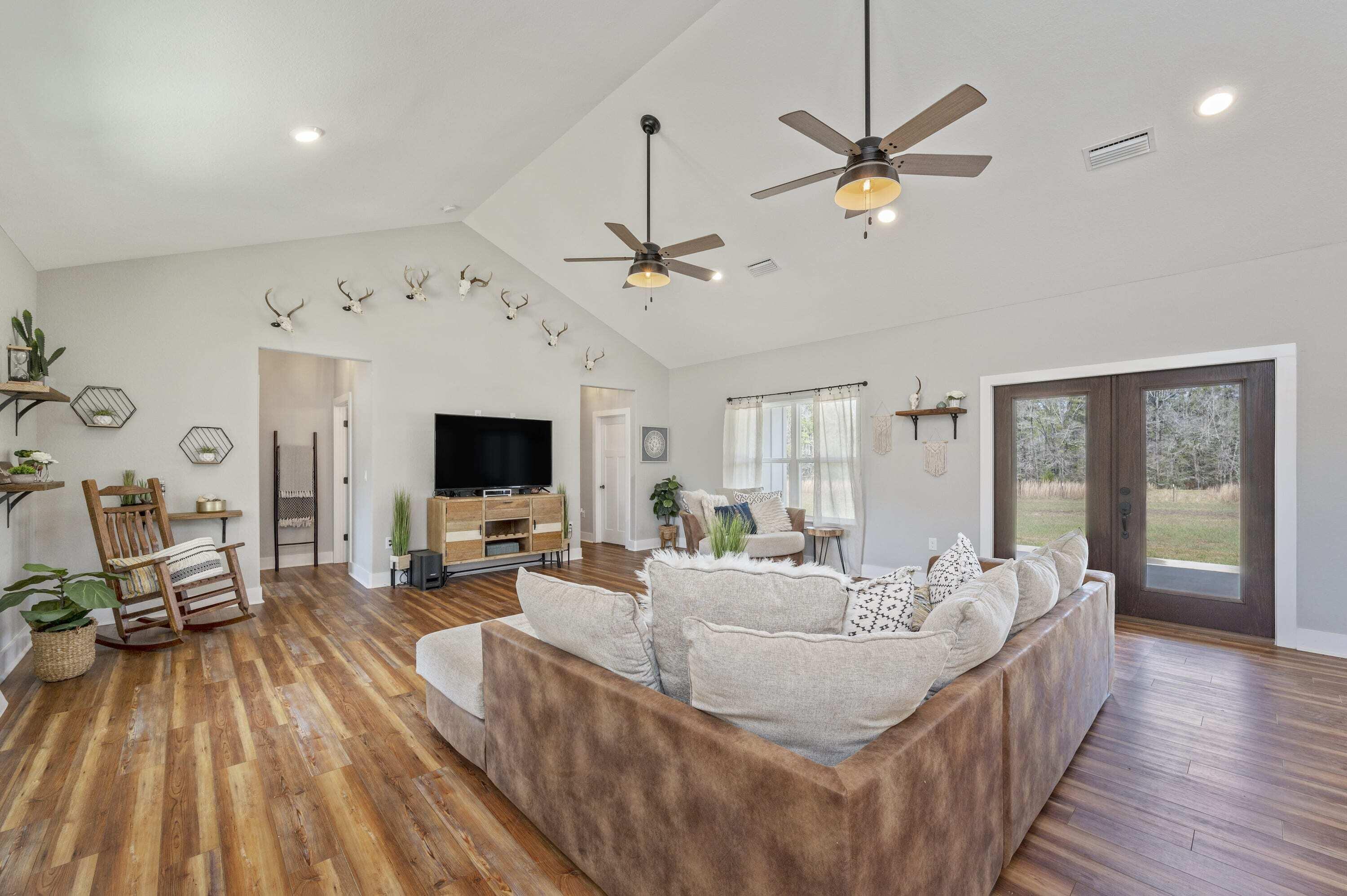 8151 Tommy Steele Road Baker, FL 32531 - Photo 10 of 36 a living room with furniture and a wooden floor