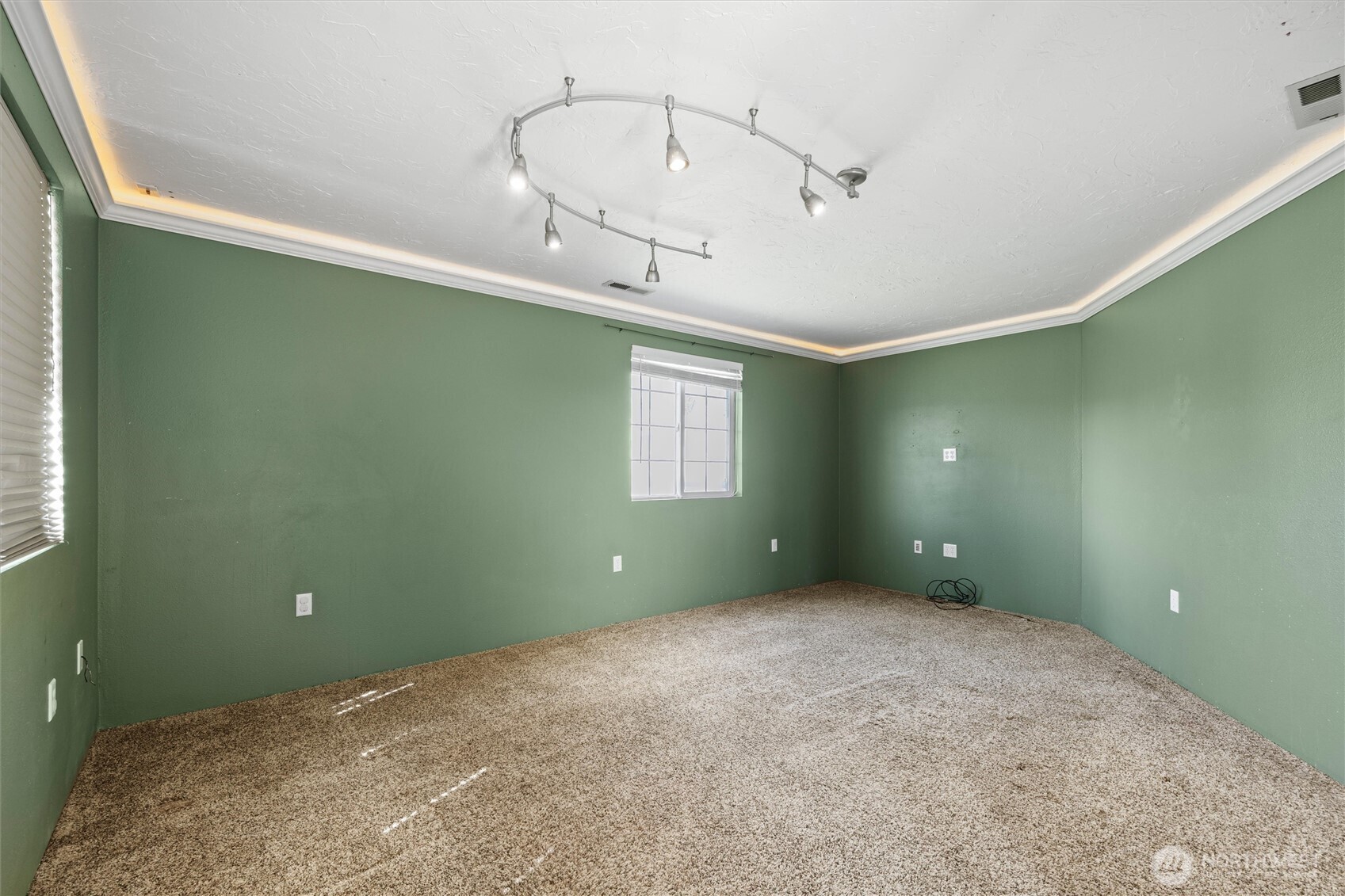 705 North 12th Street Selah, WA 98942 - Photo 20 of 32 a view of a room that has a fan and windows