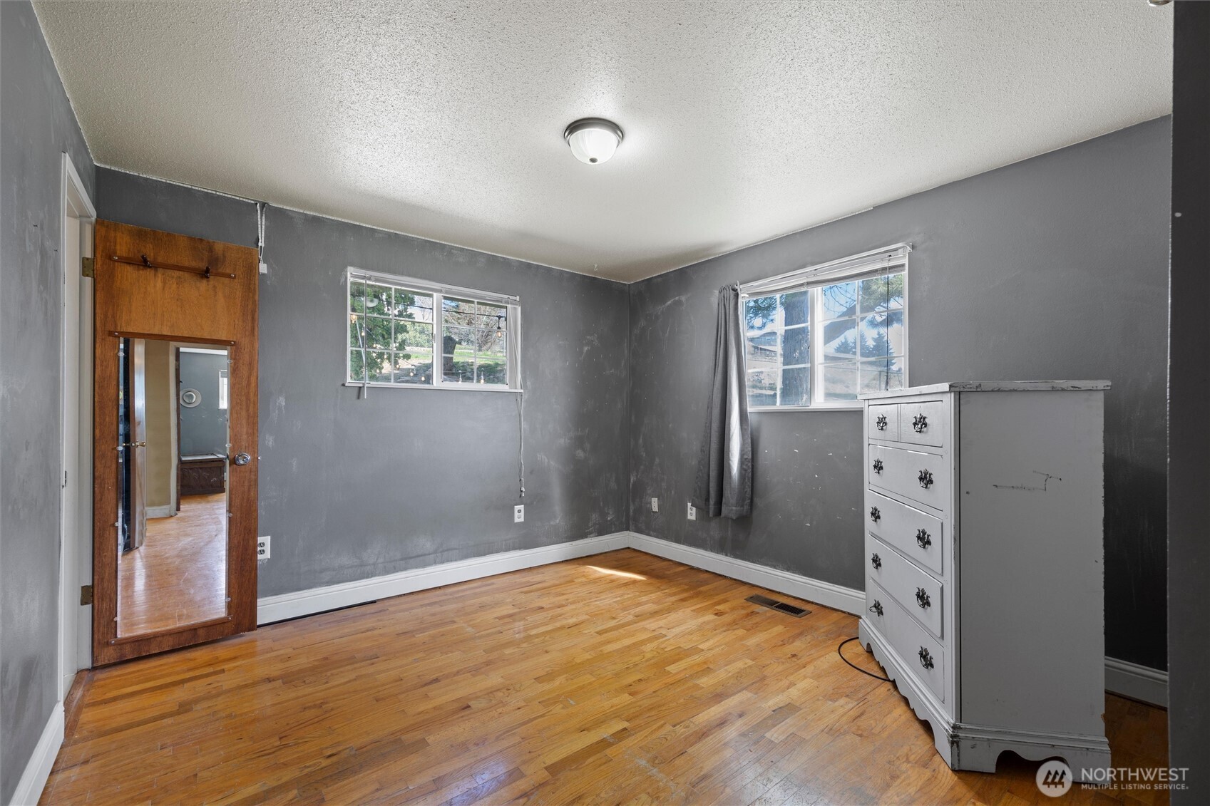 705 North 12th Street Selah, WA 98942 - Photo 27 of 32 wooden floor in an empty room with a window