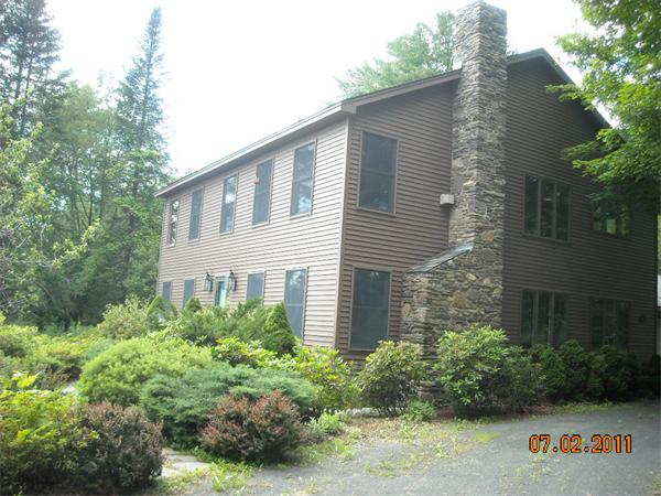 375 Kinnebrook Road Worthington, MA 01098 - Photo 1 of 12 a house that has a lot of plants in it