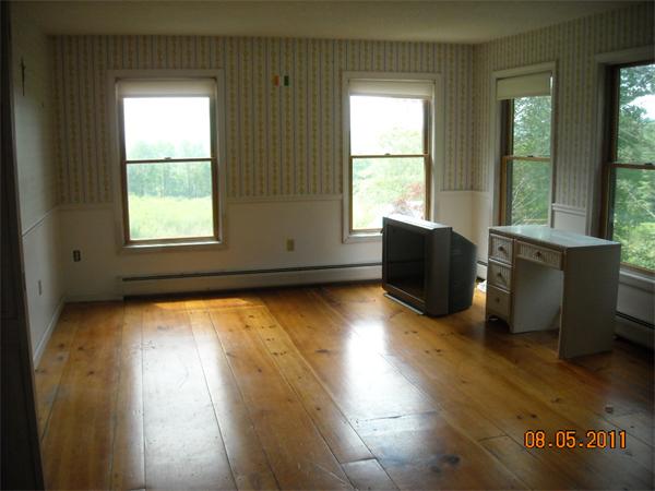 375 Kinnebrook Road Worthington, MA 01098 - Photo 11 of 12 a view of an empty room with wooden floor and a window