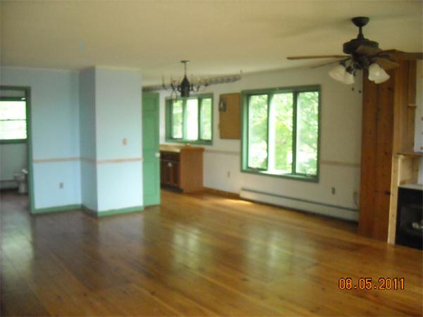 375 Kinnebrook Road Worthington, MA 01098 - Photo 12 of 12 a view of an empty room with a window and wooden floor
