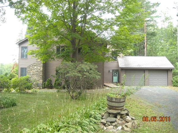 375 Kinnebrook Road Worthington, MA 01098 - Photo 3 of 12 a front view of a house with garden