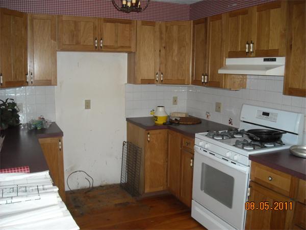 375 Kinnebrook Road Worthington, MA 01098 - Photo 8 of 12 a kitchen with stainless steel appliances granite countertop a stove a sink and a microwave