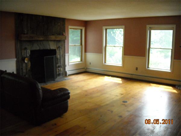 375 Kinnebrook Road Worthington, MA 01098 - Photo 9 of 12 a living room with furniture and a fireplace